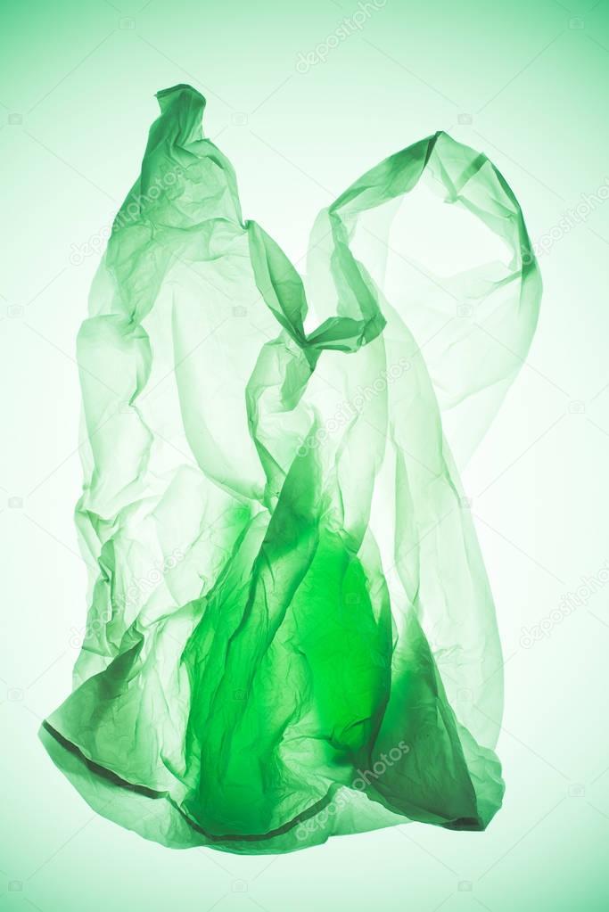 transparent plastic bag with silhouettes of bottles under colorful toned light