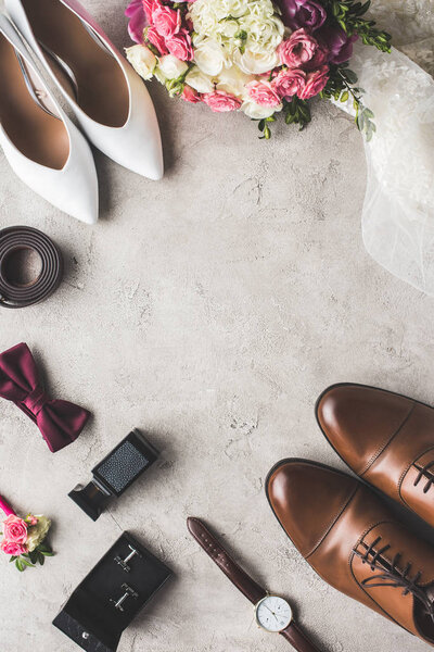 top view of wedding accessories on gray tabletop