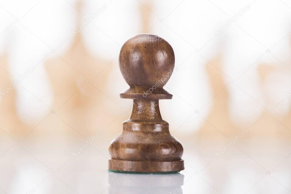 wooden chess pawn on chessboard, business concept