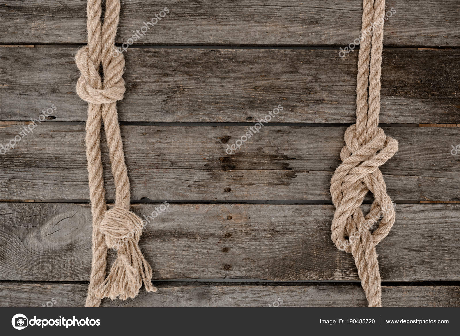 Top View Tied Nautical Rope Grunge Wooden Surface Stock Photo by