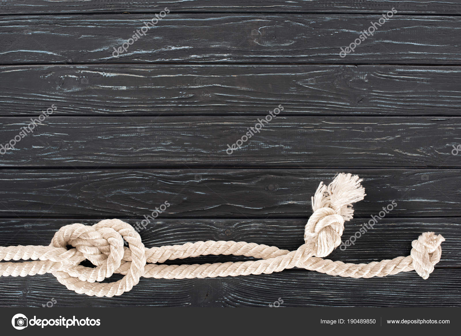 Top View White Nautical Rope Knots Dark Wooden Tabletop Stock Photo by  ©VadimVasenin 190489850