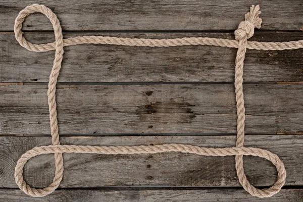 Top View Nautical Rope Knot Grunge Wooden Surface — Free Stock Photo