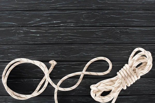 Top View Tied White Marine Rope Dark Wooden Tabletop — Free Stock Photo