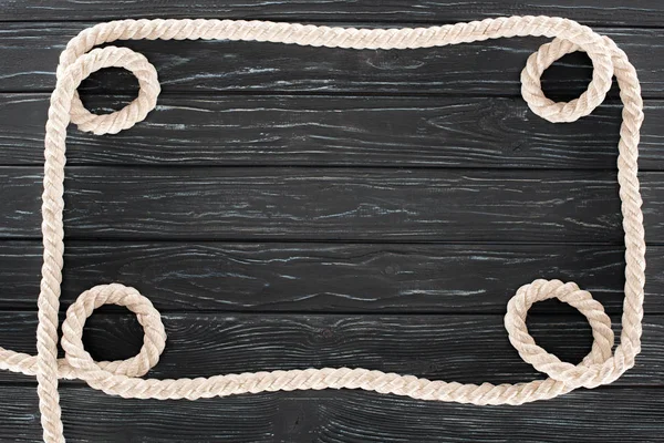 Top View White Nautical Rope Dark Wooden Surface — Free Stock Photo