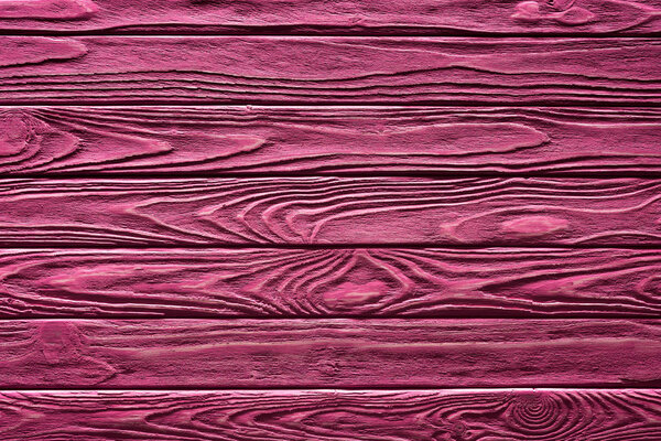 Wooden planks painted in pink background