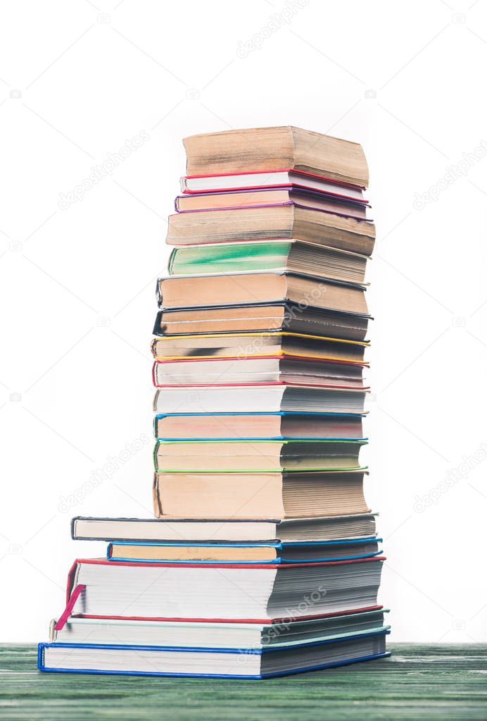 Knowledge concept with stacked books on table