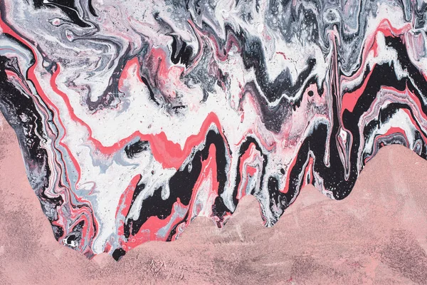 close up of abstract acrylic painted background with grey and pink 
