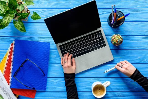 Hand Typing Laptop Keyboard Blue Wooden Table Stationery Coffee — Stock Photo, Image