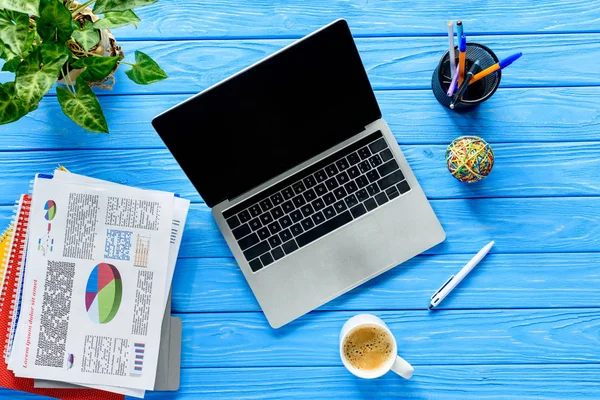 Open Laptop Business Charts Blue Wooden Table — Stock Photo, Image