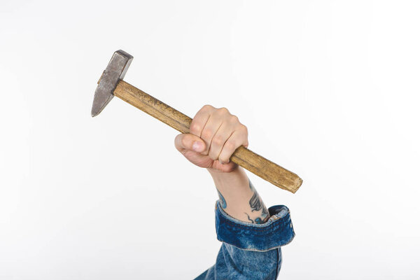 cropped image of male hand holding hammer isolated on white