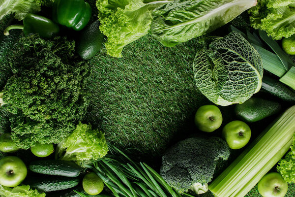 top view of green vegetables and fruits on grass, healthy eating concept