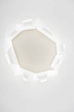 White ripped paper with copy space in center clipart