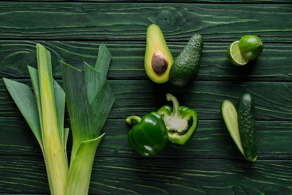Top view of cut green avocado, cucumber and lime on table, healthy eating concept — Stock Image Top View Cut Green Avocado Cucumber Lime Table Healthy Eating Royalty Free Stock Photos