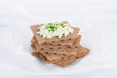 close-up view of tasty crispy crackers with cottage cheese clipart