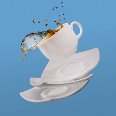 Black coffee in cup with saucers falling isolated on blue background clipart
