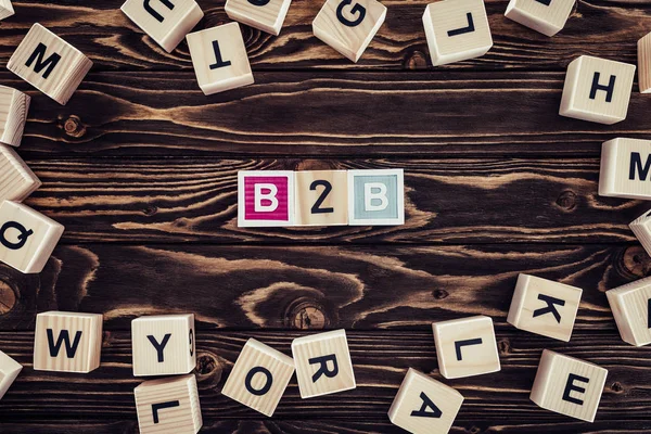 Flat Lay B2B Inscription Made Blocks Brown Wooden Tabletop — Stock Photo, Image