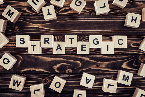 Top View Strategy Inscription Made Wooden Blocks Brown Wooden Surface — Stock Photo, Image