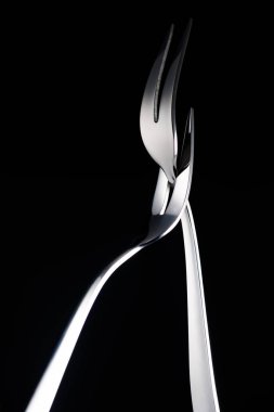 two forks with two tines isolated on black clipart