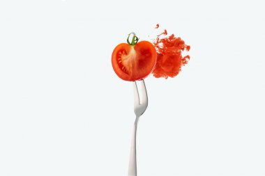 half of tomato on fork and red ink isolated on white clipart