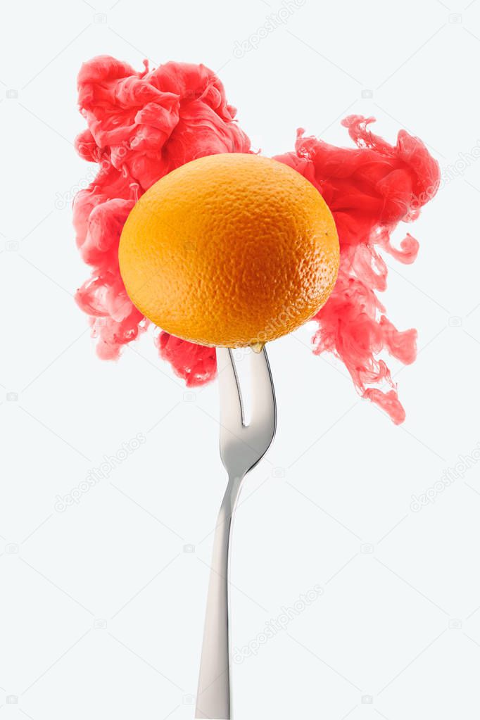 orange on fork and red ink isolated on white