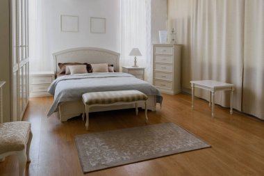 Elegant bedroom interior in light tones clipart