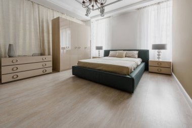 Large bed in modern renovated bedroom
