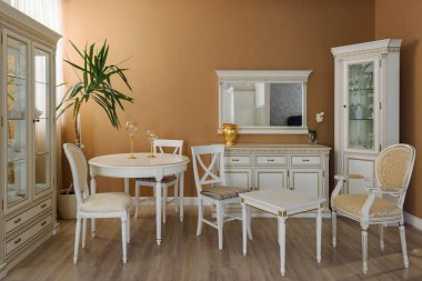 White furniture in elegant dining room clipart