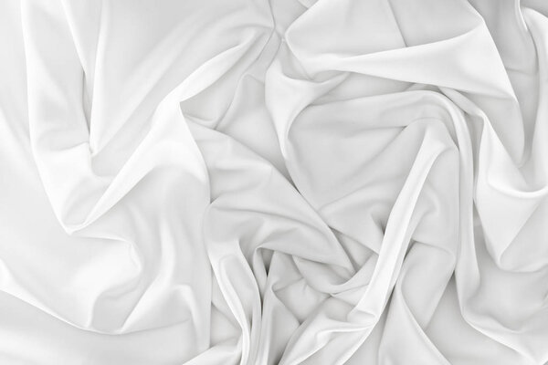 close up view of white soft silk fabric as backdrop