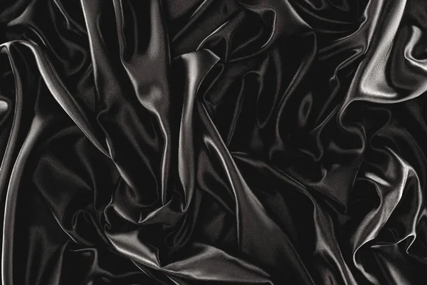 full frame of black elegant silk cloth as background