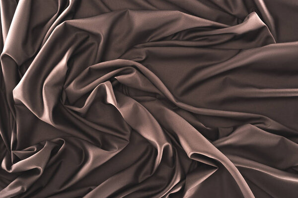 full frame of folded dark silk cloth as background
