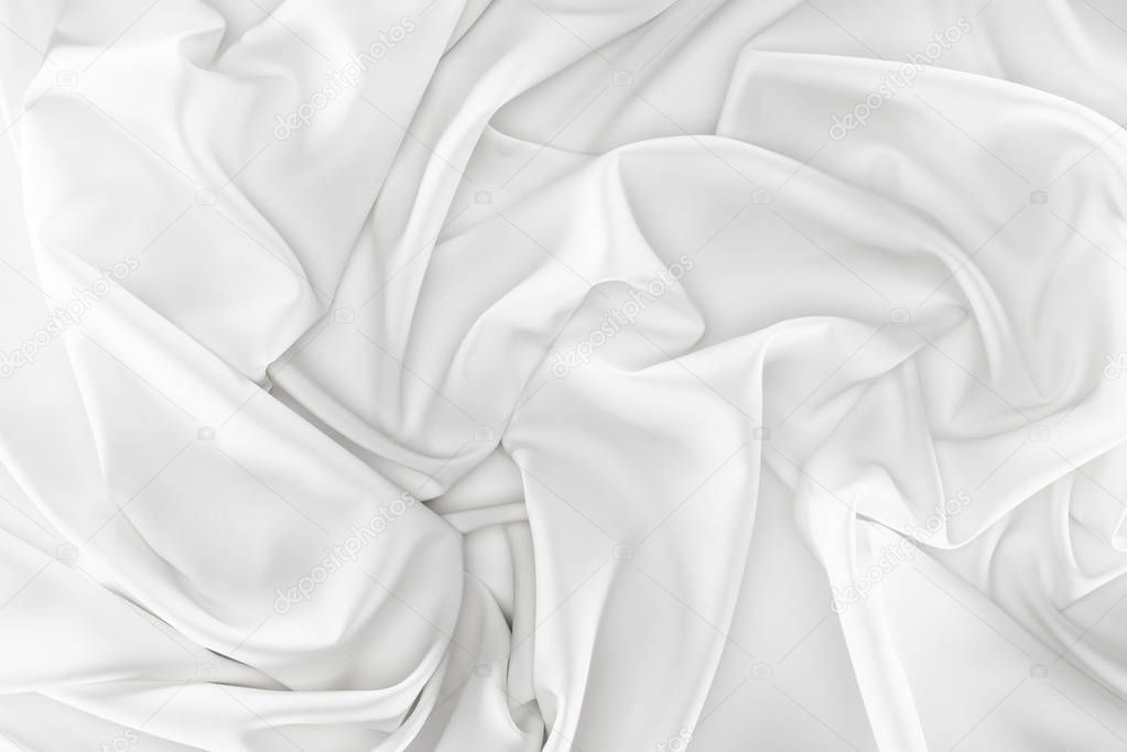 close up view of white soft silk fabric as backdrop