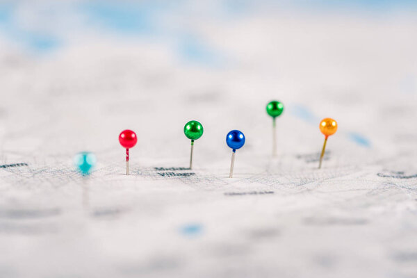 close-up shot of colorful pins on map