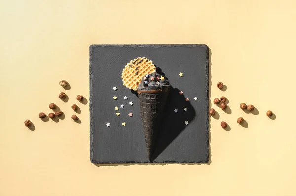 top view of black ice cream on yellow