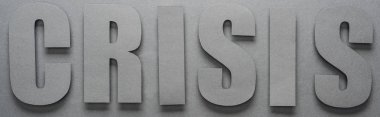 top view of word crisis on grey background with shadows, panoramic shot clipart
