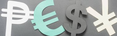 top view of peso, euro, dollar and yen sign on grey background, panoramic shot clipart