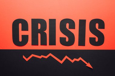 top view of word crisis and recession arrow on black and red background divided horizontally clipart