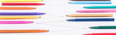 selective focus of colorful felt-tip pens on white background with connected drawn lines, connection and communication concept clipart