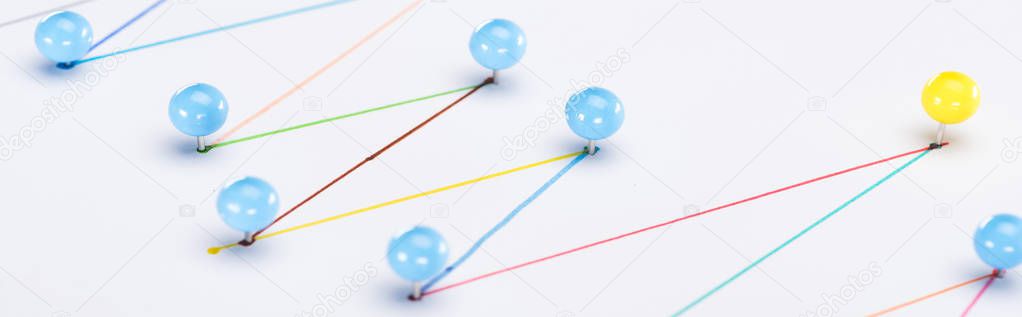 close up view of colorful connected drawn lines with pins, connection and leadership concept