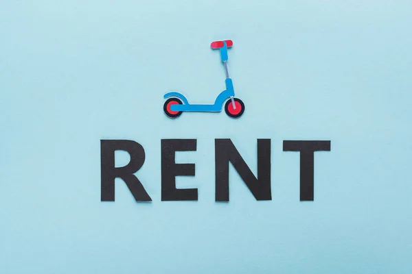 Top View Paper Cut Kick Scooter Black Rent Lettering Blue — Stock Photo, Image