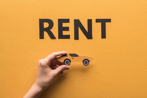 Cropped View Woman Holding Paper Cut Sports Car Rent Lettering — Stock Photo, Image