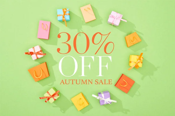 Frame Decorative Gift Boxes Shopping Bags Green Background Percent Autumn — Stock Photo, Image