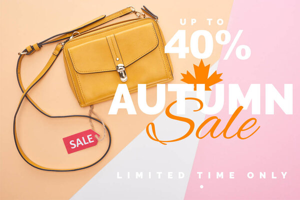 top view of bag with sale label on beige, white and pink background with autumn sale, up to 40 percent illustration 