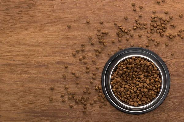 Top View Dry Pet Food Silver Bowl Wooden Table — Stock Photo, Image