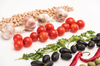close up view of chickpea, garlic, cherry tomatoes, parsley, chili pepper, olives on white background clipart