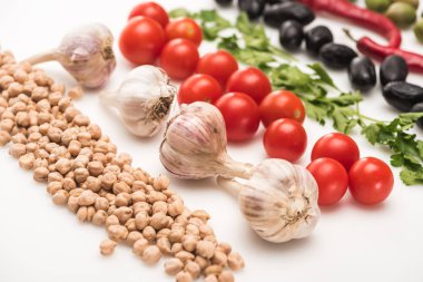 close up view of chickpea, garlic, cherry tomatoes, parsley, olives on white background clipart