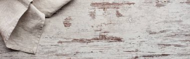 Top view of tablecloth on weathered wooden texture, panoramic shot clipart