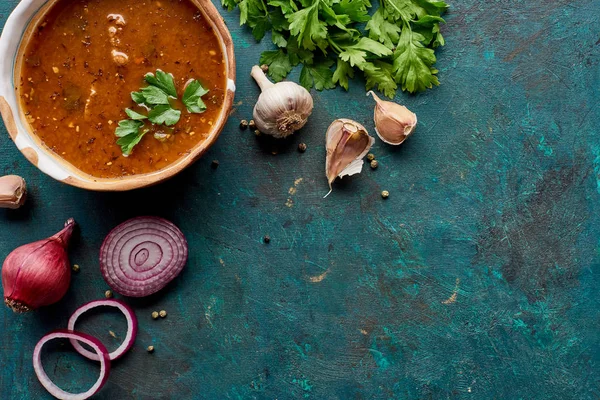Top view of soup kharcho with cilantro and vegetables on textured green background — Stock Image Top View Soup Kharcho Cilantro Vegetables Textured Green Background Royalty Free Stock Images