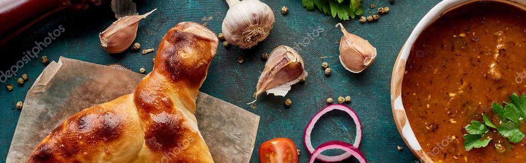 Soup kharcho and adjarian khachapuri with spices and vegetables on textured green background, panoramic shot — Stock Image Soup Kharcho Adjarian Khachapuri Spices Vegetables Textured Green Background Panoramic Stock Photo