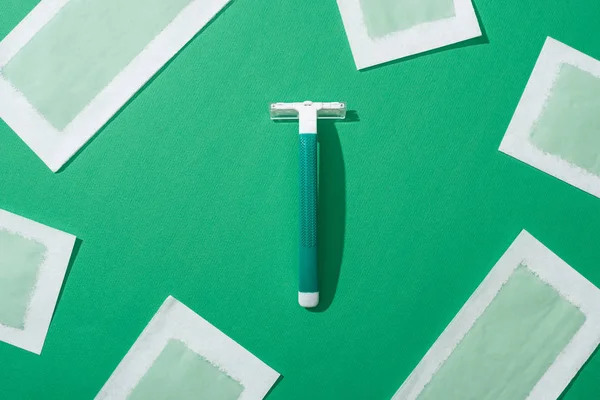 Top View Green Disposable Razor Depilation Wax Stripes Green Background — Stock Photo, Image