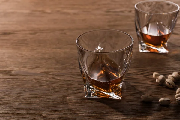 Glasses Brandy Pistachios Wooden Table — Stock Photo, Image